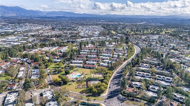 birds eye view of property featuring a mountain view