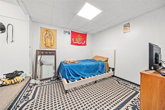 bedroom with a paneled ceiling