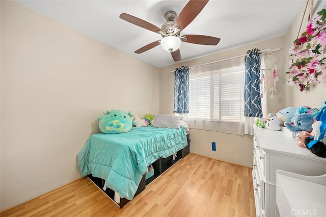 bedroom featuring ceiling fan and light hardwood / wood-style floors