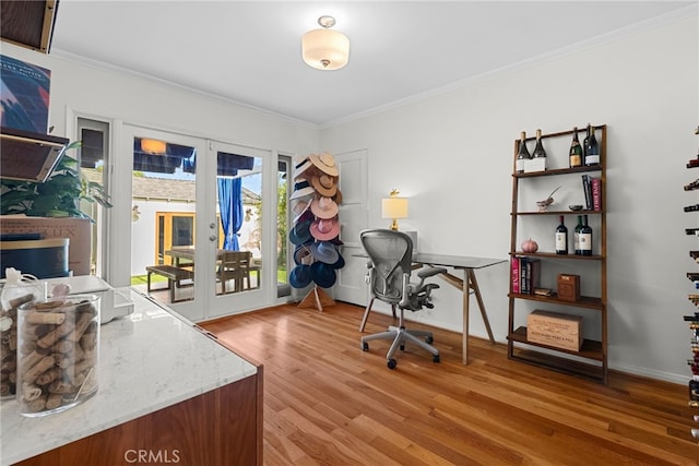 office area featuring crown molding, hardwood / wood-style floors, and french doors