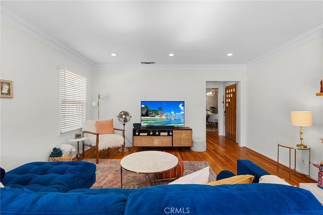 living room with crown molding and wood-type flooring