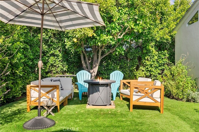 view of yard with an outdoor fire pit