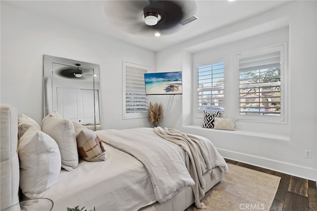 bedroom with hardwood / wood-style flooring and ceiling fan