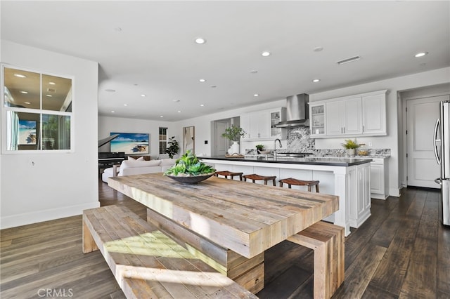 dining space featuring dark hardwood / wood-style flooring