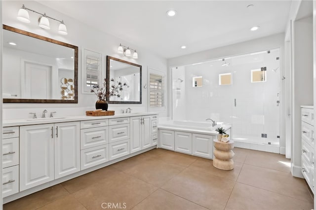 bathroom featuring vanity, tile patterned flooring, and shower with separate bathtub