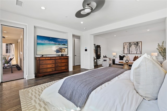 bedroom with dark hardwood / wood-style flooring