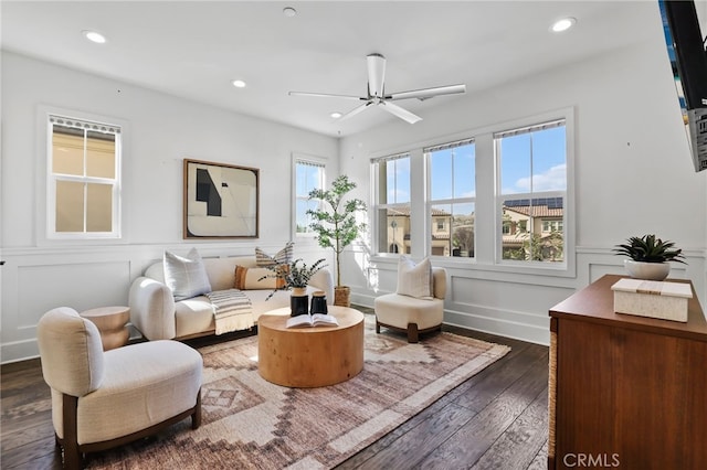 sitting room featuring ceiling fan and dark hardwood / wood-style flooring