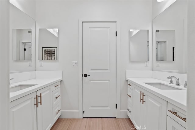 bathroom with vanity and hardwood / wood-style flooring