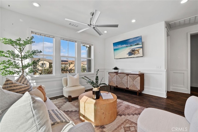 living room featuring dark hardwood / wood-style floors and ceiling fan