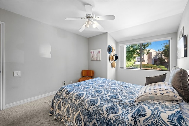 bedroom featuring ceiling fan and carpet