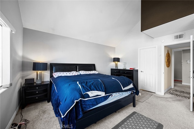 carpeted bedroom featuring vaulted ceiling