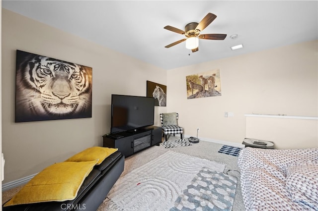 carpeted living room with ceiling fan