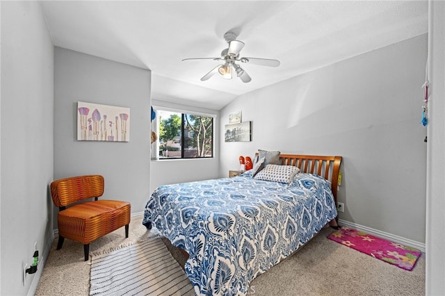 carpeted bedroom featuring ceiling fan and lofted ceiling