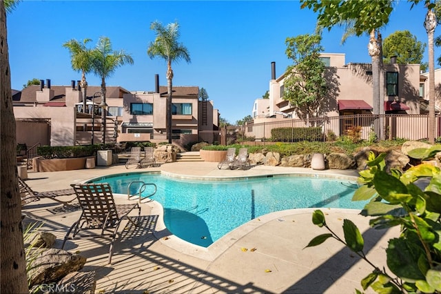 view of swimming pool with a patio area