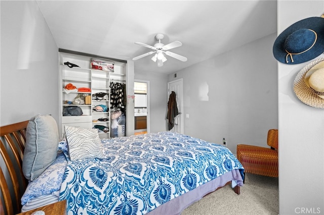 carpeted bedroom featuring a closet and ceiling fan