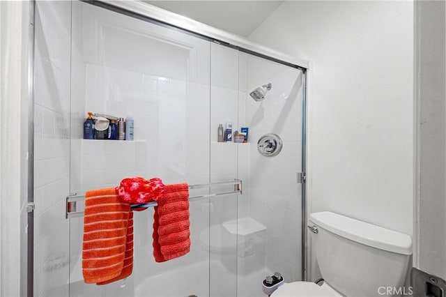 bathroom with walk in shower and toilet