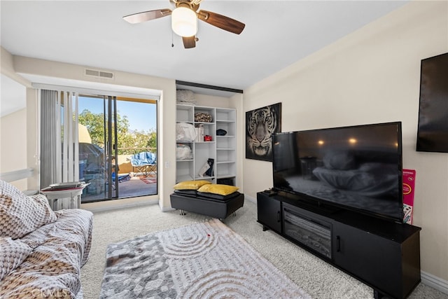 living room with ceiling fan and light carpet