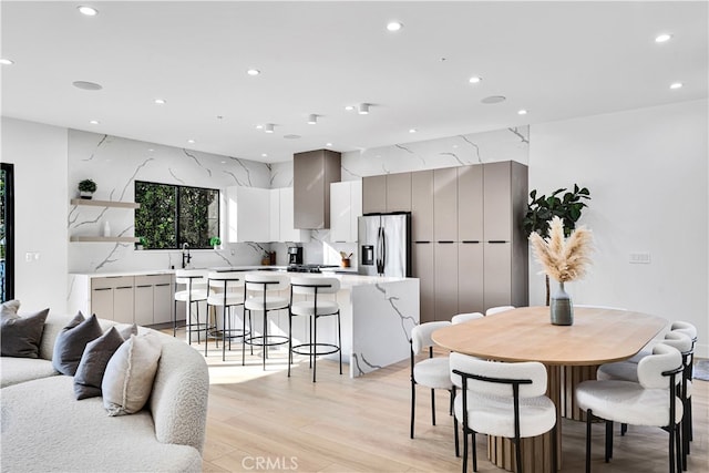 dining area with light hardwood / wood-style flooring