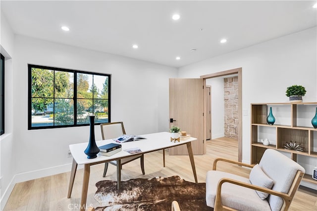 office with light hardwood / wood-style floors