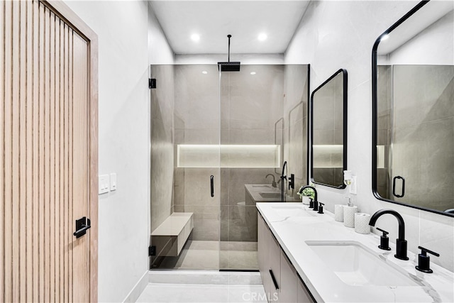 bathroom featuring vanity and an enclosed shower