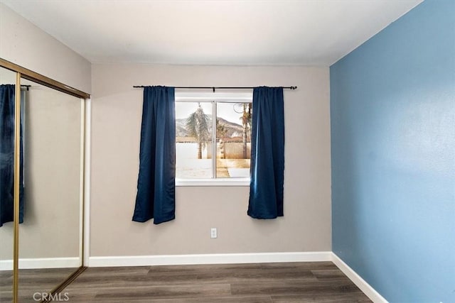 empty room featuring dark hardwood / wood-style floors