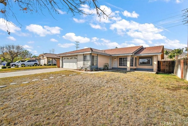 ranch-style house featuring a garage and a front lawn