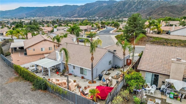 birds eye view of property with a mountain view