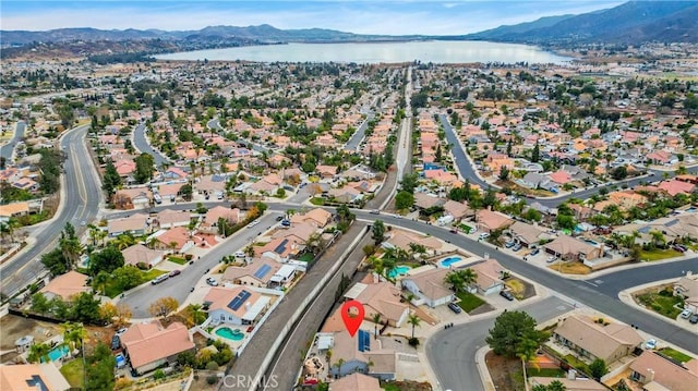 bird's eye view with a water and mountain view