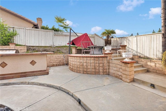 view of patio with a fenced backyard