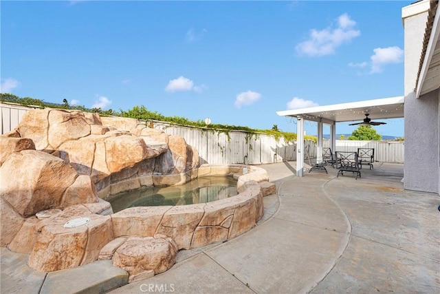 exterior space with a fenced backyard and a ceiling fan