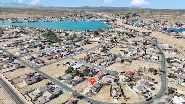 aerial view featuring a water and mountain view