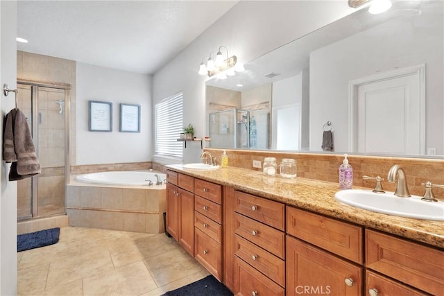 bathroom featuring double vanity, a sink, a shower stall, and a bath