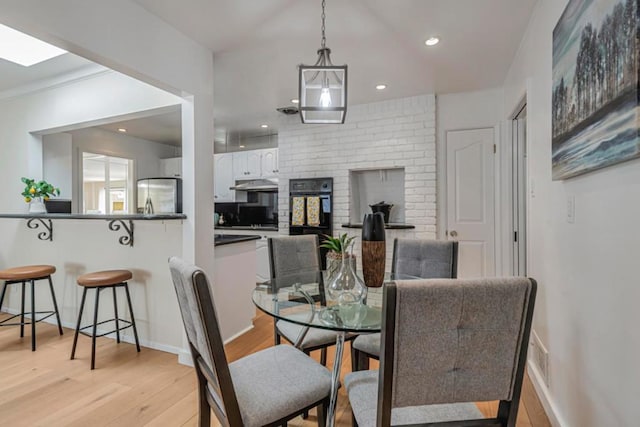 dining area featuring light wood-type flooring