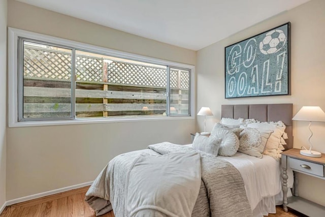 bedroom with wood-type flooring