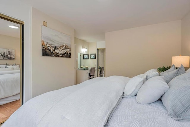 bedroom with hardwood / wood-style floors