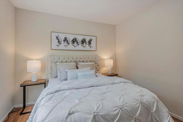 bedroom with wood-type flooring