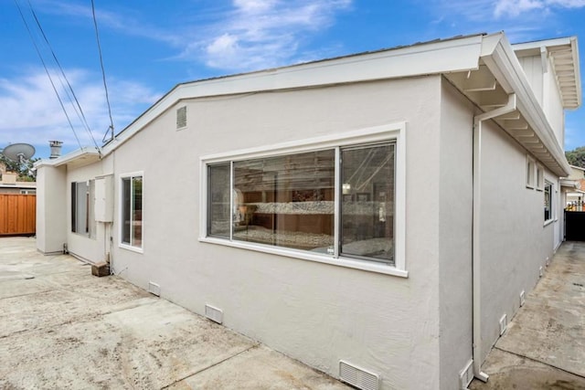 view of property exterior featuring a patio area