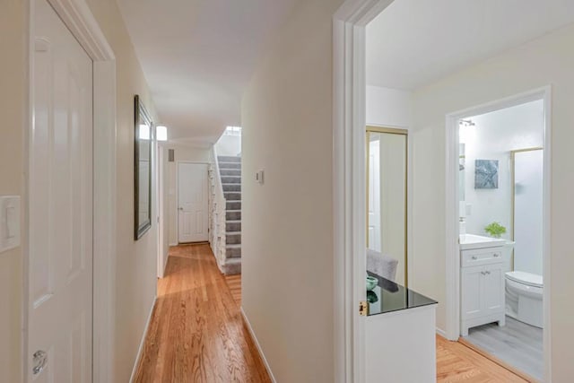 corridor featuring light hardwood / wood-style floors