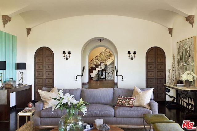 living room featuring lofted ceiling