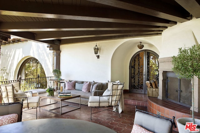 view of patio / terrace featuring an outdoor living space with a fireplace