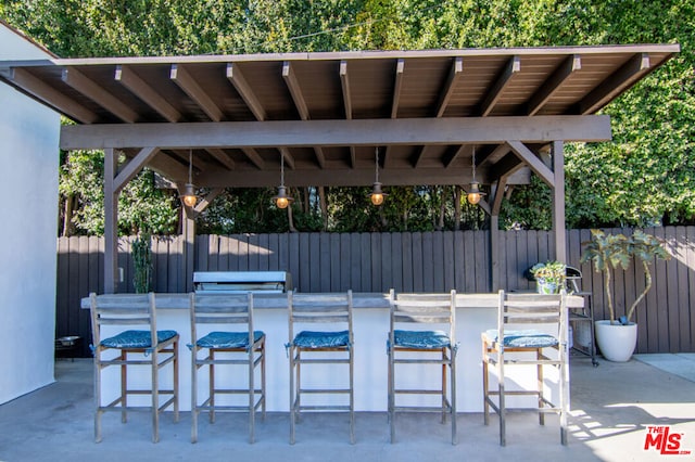 view of patio featuring exterior bar