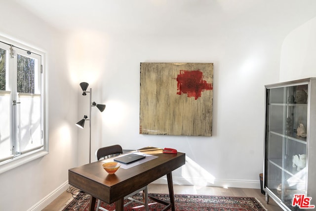 office area with hardwood / wood-style floors