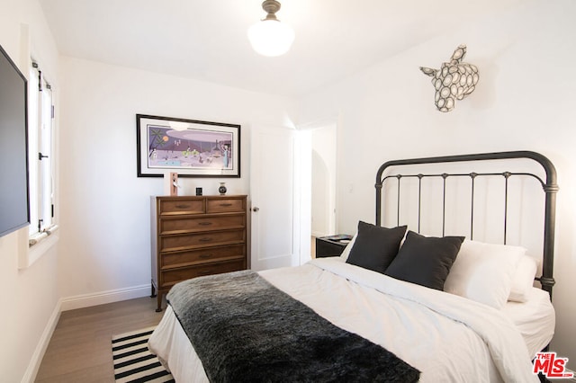 bedroom featuring hardwood / wood-style flooring