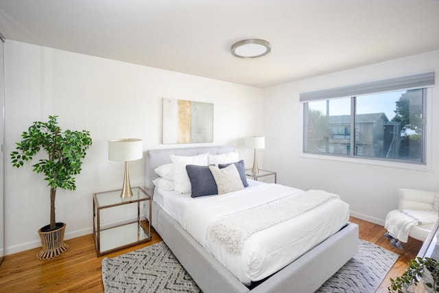 bedroom with hardwood / wood-style floors