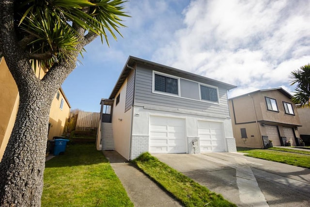 view of front of home with a garage and a front yard