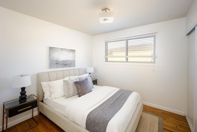 bedroom featuring dark wood-type flooring