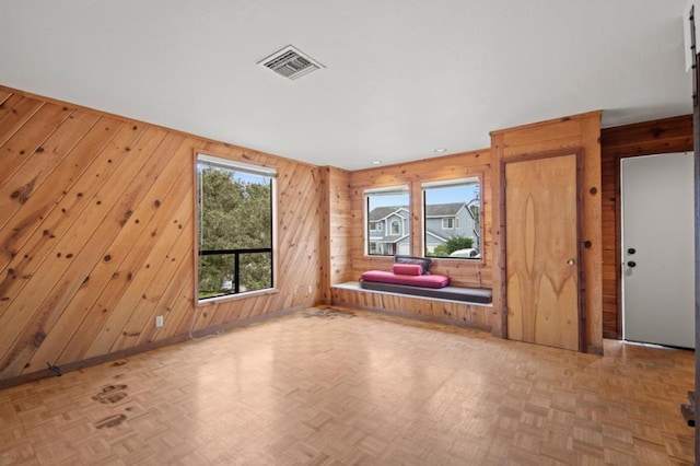 spare room with parquet floors and a wealth of natural light