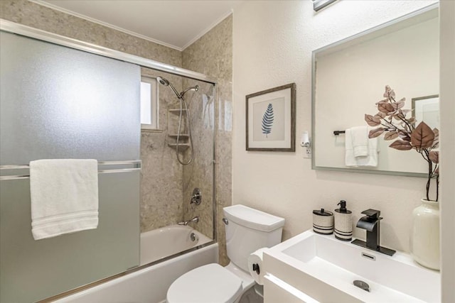 full bathroom with vanity, bath / shower combo with glass door, ornamental molding, and toilet