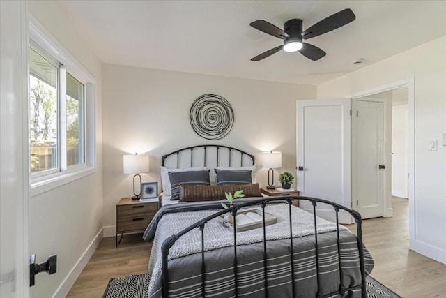 bedroom featuring ceiling fan and light hardwood / wood-style floors