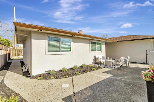 back of house with a patio